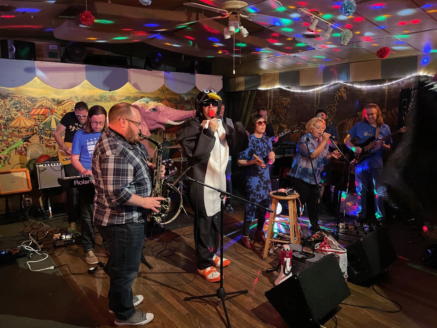 Full band at Carousel Lounge with penguin costume and disco lights